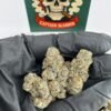 Mother's Milk cannabis flower strain with frosty trichomes and dense premium buds